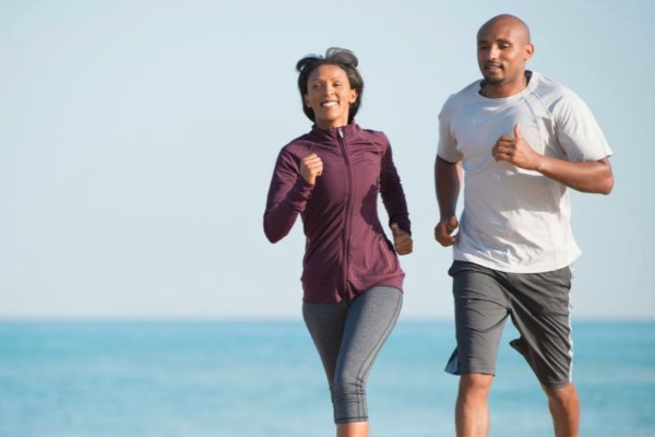 Couple running on the beach